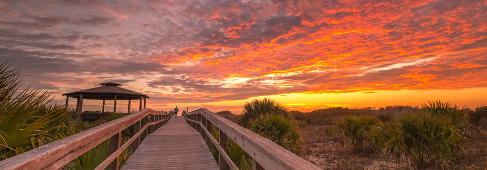 Orange sky in tybee island pier and pavilion